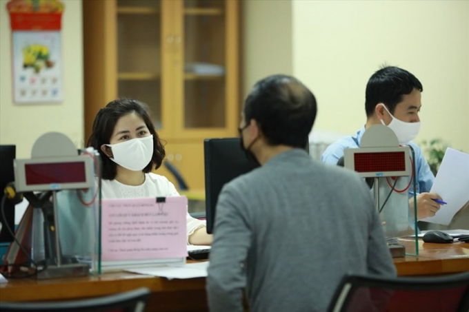 Bộ T&agrave;i ch&iacute;nh đề xuất tiếp tục giảm ph&iacute;, lệ ph&iacute; hỗ trợ người d&acirc;n, doanh nghiệp v&agrave; đối tượng ảnh hưởng bởi dịch Covid-19. (Ảnh minh họa)