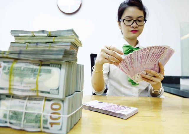 Tỷ gi&#225; VND/USD tăng &#39;giật m&#236;nh&#39;, &#225;p lực đẩy l&#227;i suất đi l&#234;n nhanh ch&#243;ng? - Ảnh 1